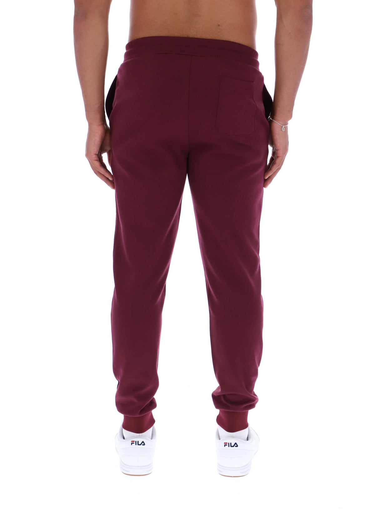 Maroon sweatpants worn by a person on a white background
