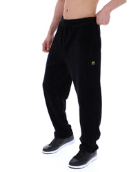 Displays the model wearing the Black 'FILA' branded Lorrie Velour Track Pant