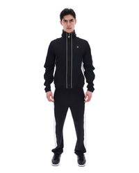 Man wearing a black tracksuit with white stripes on a white background