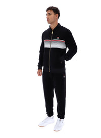 Displays a model wearing the Black 'FILA' branded Malakai Striped Track Top