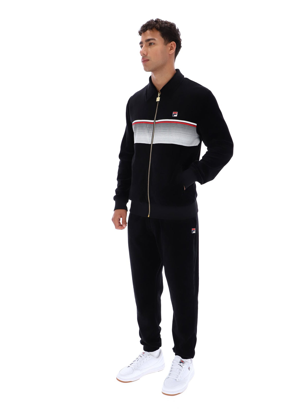 Displays a model wearing the Black 'FILA' branded Malakai Striped Track Top