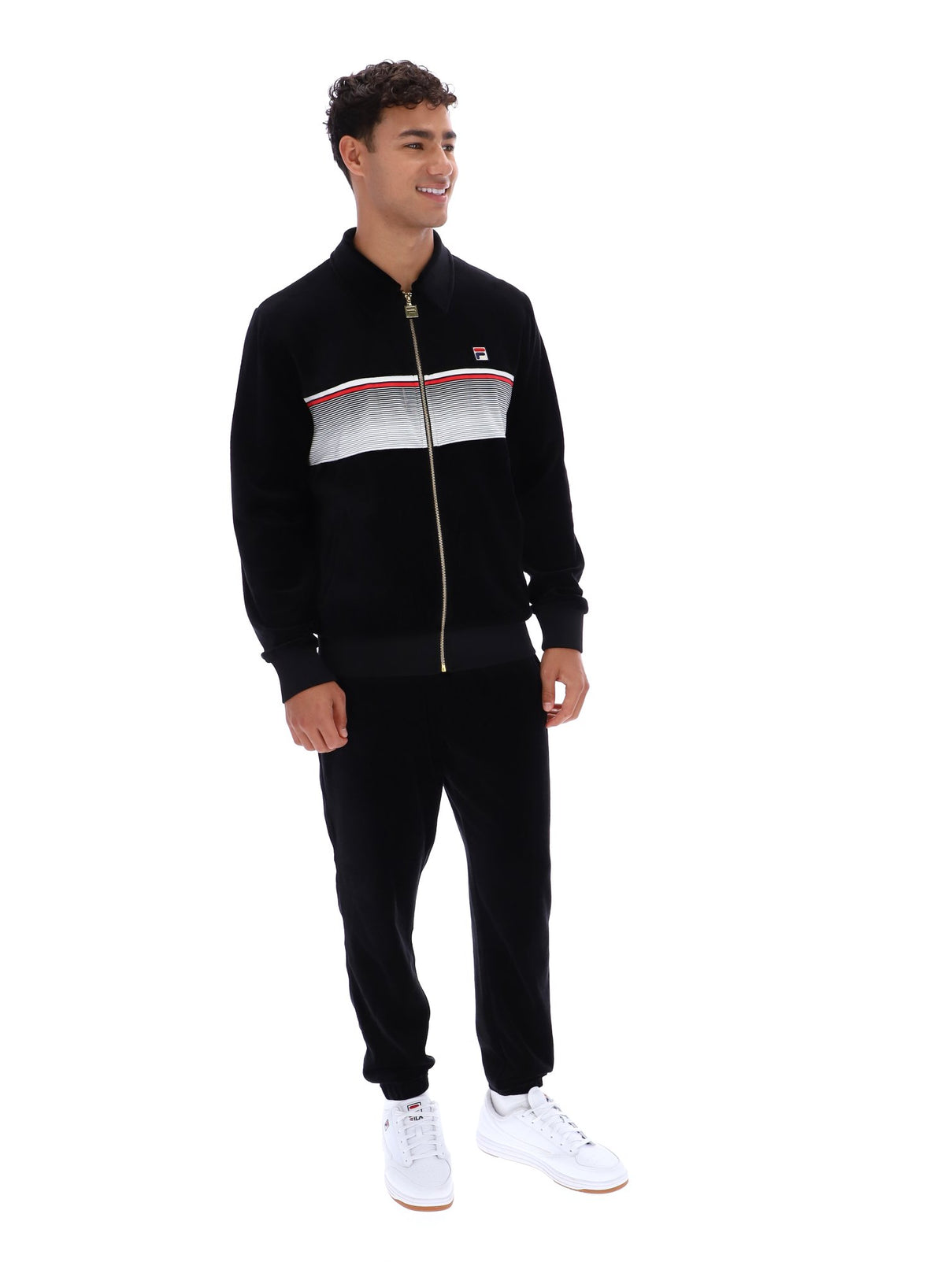 Displays a model wearing the Black 'FILA' branded Malakai Striped Track Top