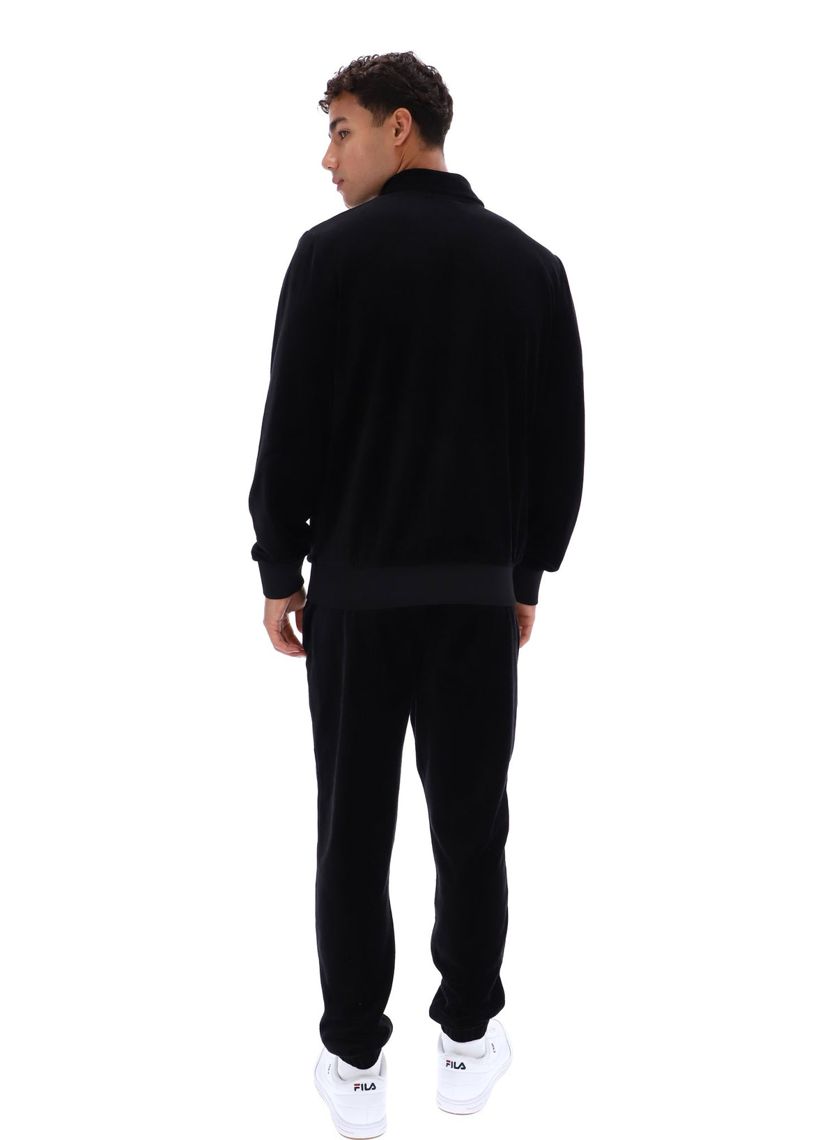 Displays a model wearing the Black 'FILA' branded Malakai Striped Track Top