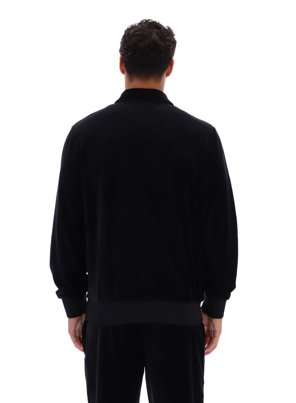 Displays a model wearing the Black 'FILA' branded Malakai Striped Track Top