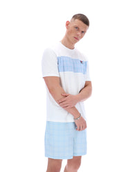 Person wearing a white t-shirt with a blue stripe and light blue shorts on a white background