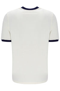 A white and navy ringer t-shirt on a white background