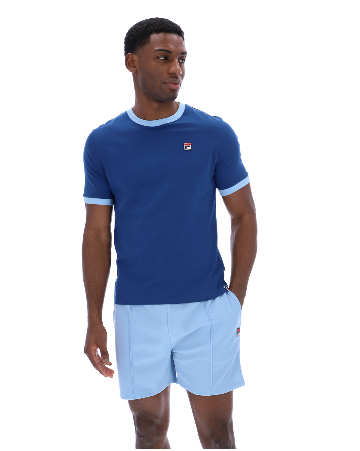 Displays a model wearing the Limoges 'FILA' branded Marconi Essential Ringer T-Shirt