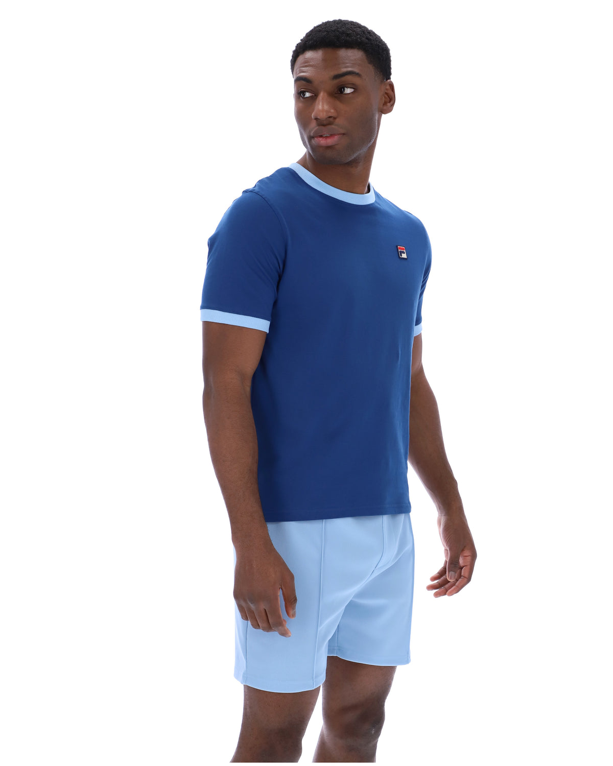 Displays a model wearing the Limoges 'FILA' branded Marconi Essential Ringer T-Shirt
