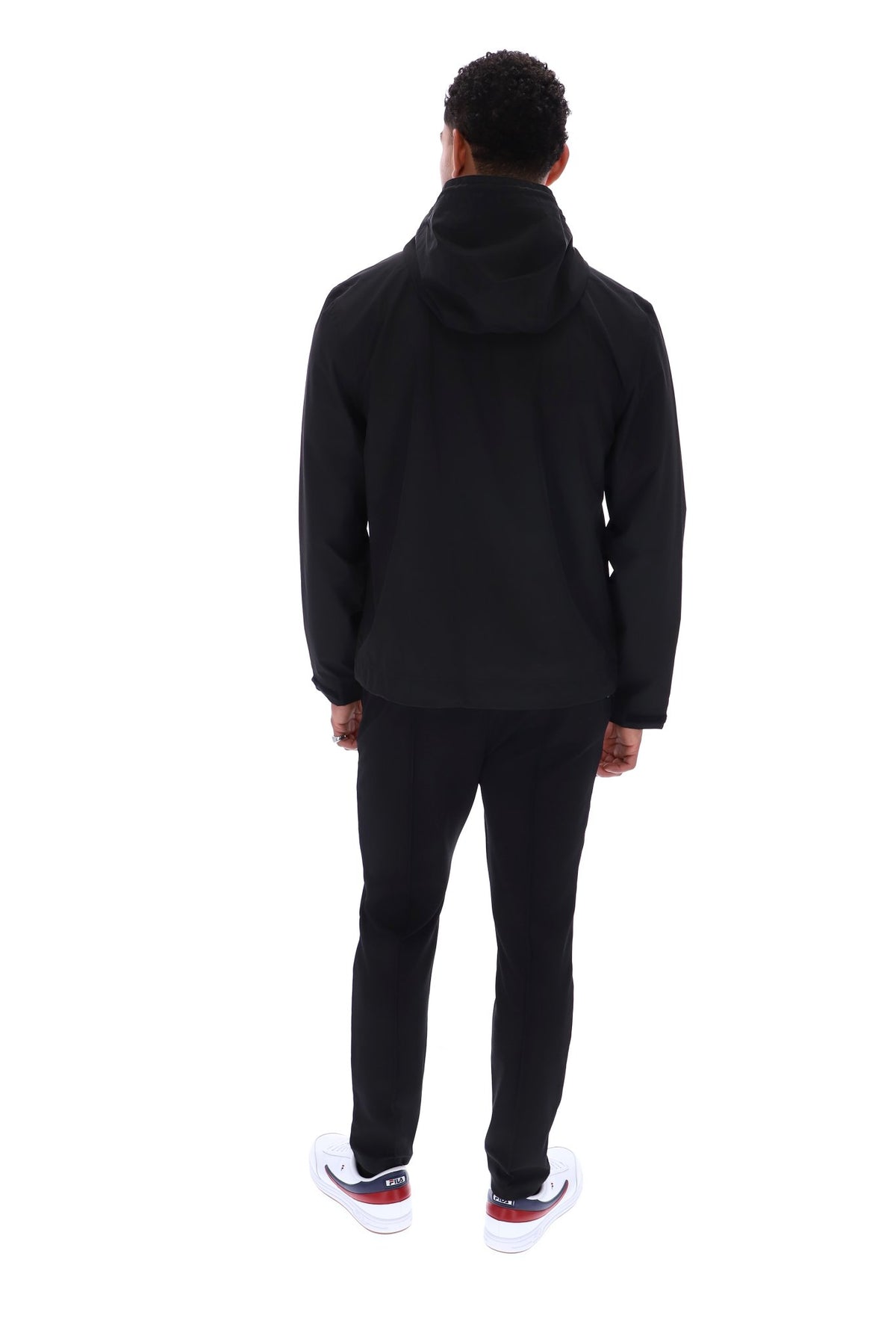 Displays a model wearing the Black 'FILA' branded Marcos Full Zip Jacket