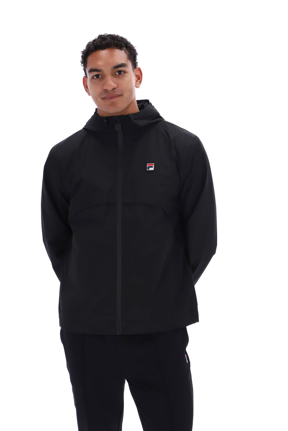 Displays a model wearing the Black 'FILA' branded Marcos Full Zip Jacket