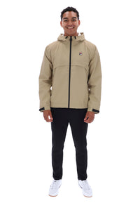 A man wearing a beige hooded jacket with a black zipper, black pants, and white sneakers, standing against a plain white background. The jacket features a small red and white logo on the left chest.