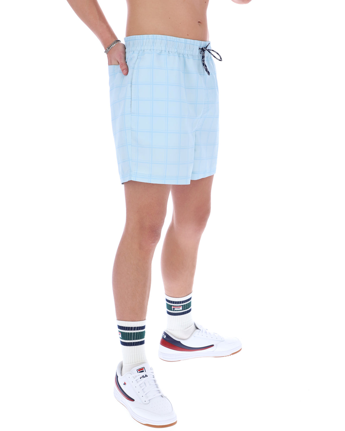 Light blue shorts worn by a person on a white background