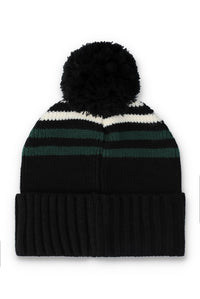A black knit pom-pom beanie hat with horizontal stripes in white and dark green, featuring a ribbed cuff and a fluffy black pom-pom on top, set against a plain white background.