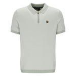 Light green polo shirt with a brand logo on a white background
