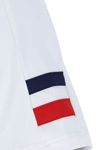 White tennis t-shirt with cap sleeves, featuring the FILA logo and a Union Jack flag patch on the chest.