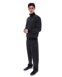 Displays a model wearing the Black 'FILA' branded Mathers Herringbone Track Top