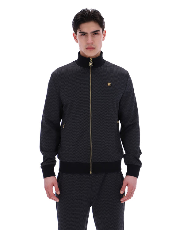 Displays a model wearing the Black 'FILA' branded Mathers Herringbone Track Top