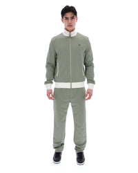 Displays a model wearing the Sea Foam 'FILA' branded Mathers Herringbone Track Top