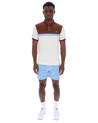 Displays a model wearing the Gardenia Mattia 'FILA' branded Contrast Panel Polo Shirt