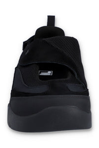 Black slip-on sneakers with black strap on a white background
