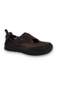 Brown flat shoe with a strap on a white background