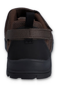 Brown flat shoe with a strap on a white background