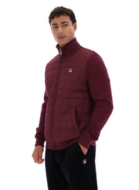 Displays a model wearing the Fig Moor 'FILA' branded Padded Front Jacket