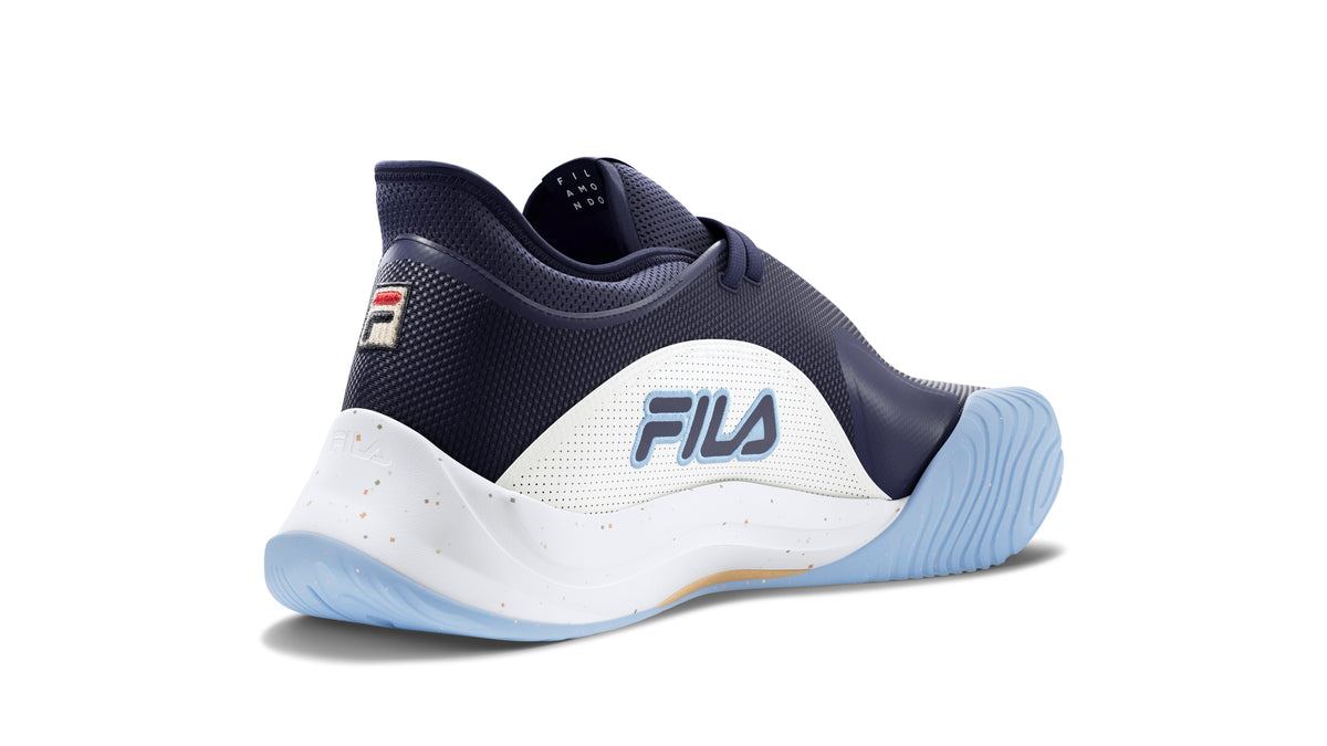 A pair of FILA Mondo Forza Tennis Trainers in white and navy colour scheme.
