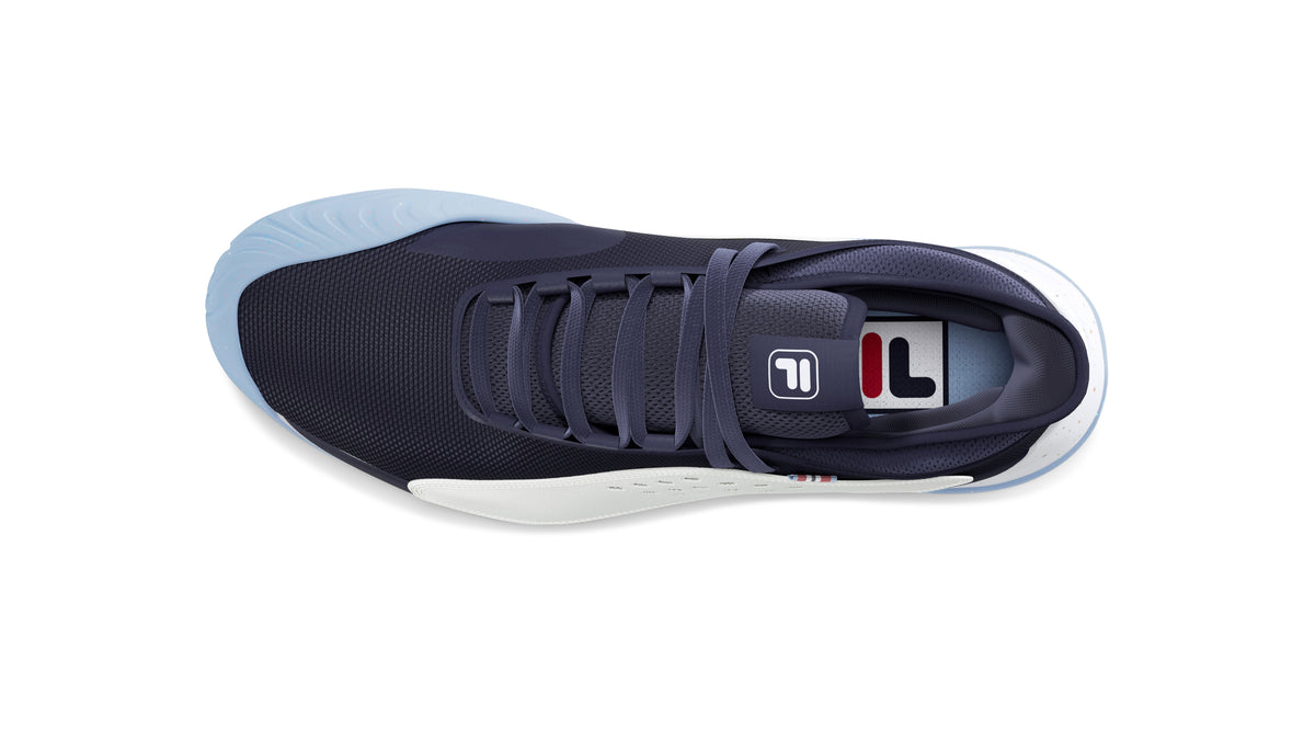 A pair of FILA Mondo Forza Tennis Trainers in white and navy colour scheme.