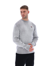 Displays a model wearing the Gardenia 'FILA' branded Noah Knitted Crew Neck