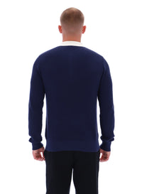 Man wearing a navy blue sweater on a white background