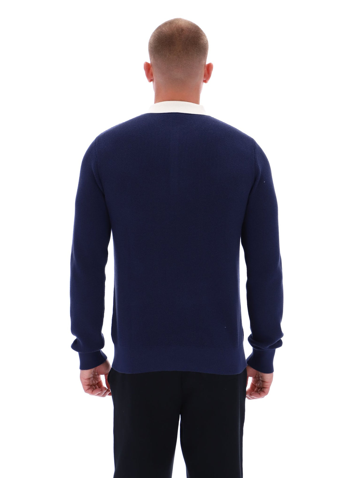 Man wearing a navy blue sweater on a white background