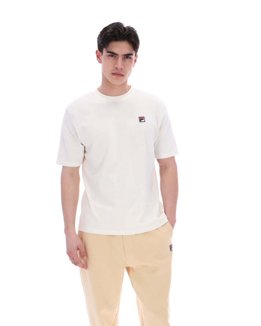 Man wearing a white t-shirt with a logo on a white background