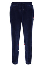 Navy blue jogger pants with small red and white patches on a white background