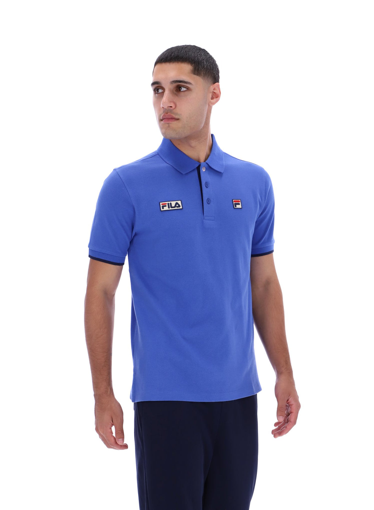 Displays a model wearing the Dazzling Blue 'FILA' branded Pablo Three-Button Tipped Rib Polo Shirt