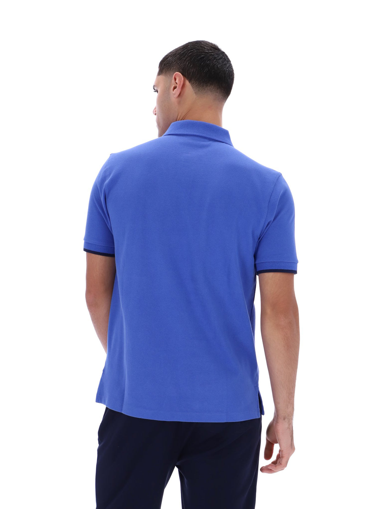 Displays a model wearing the Dazzling Blue 'FILA' branded Pablo Three-Button Tipped Rib Polo Shirt