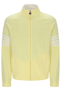 A pale yellow track jacket with a stand-up collar, front zipper, and three white stripes on each sleeve, shown against a plain white background.