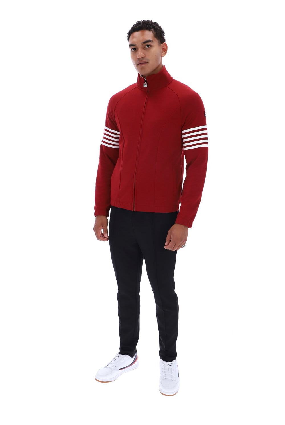 Displays a model wearing the Sun Dried 'FILA' branded Tomato/ White Patrice Cut And Sew Jacket