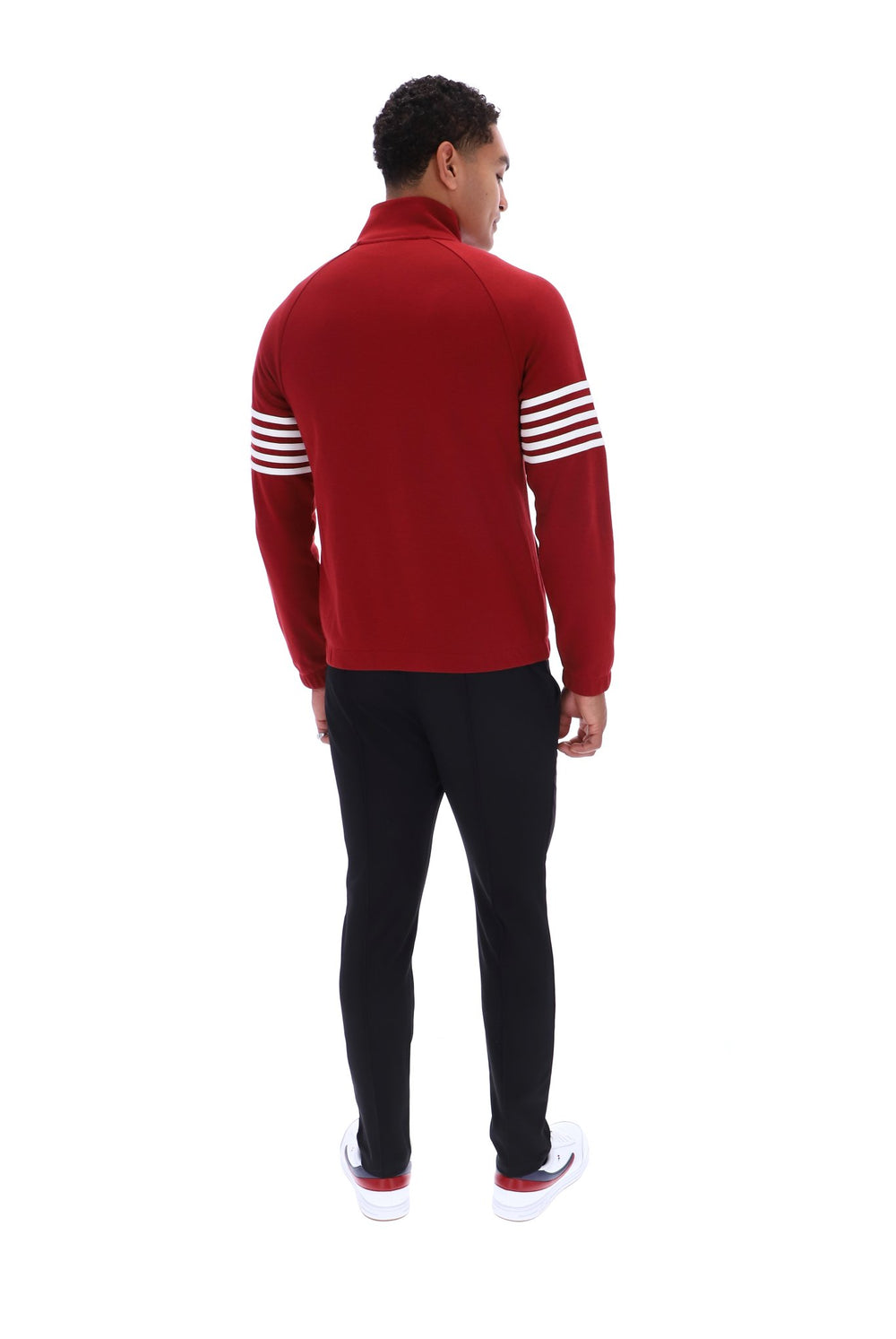 Displays a model wearing the Sun Dried 'FILA' branded Tomato/ White Patrice Cut And Sew Jacket