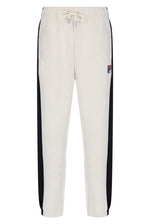 Off-white jogger sweatpants with black side stripes and a small Fila logo patch on the left thigh, featuring an elastic waistband with a drawstring.