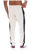 Displays a model wearing the Gardenia/ Black 'FILA' branded Patrico Colour Blocked Pant