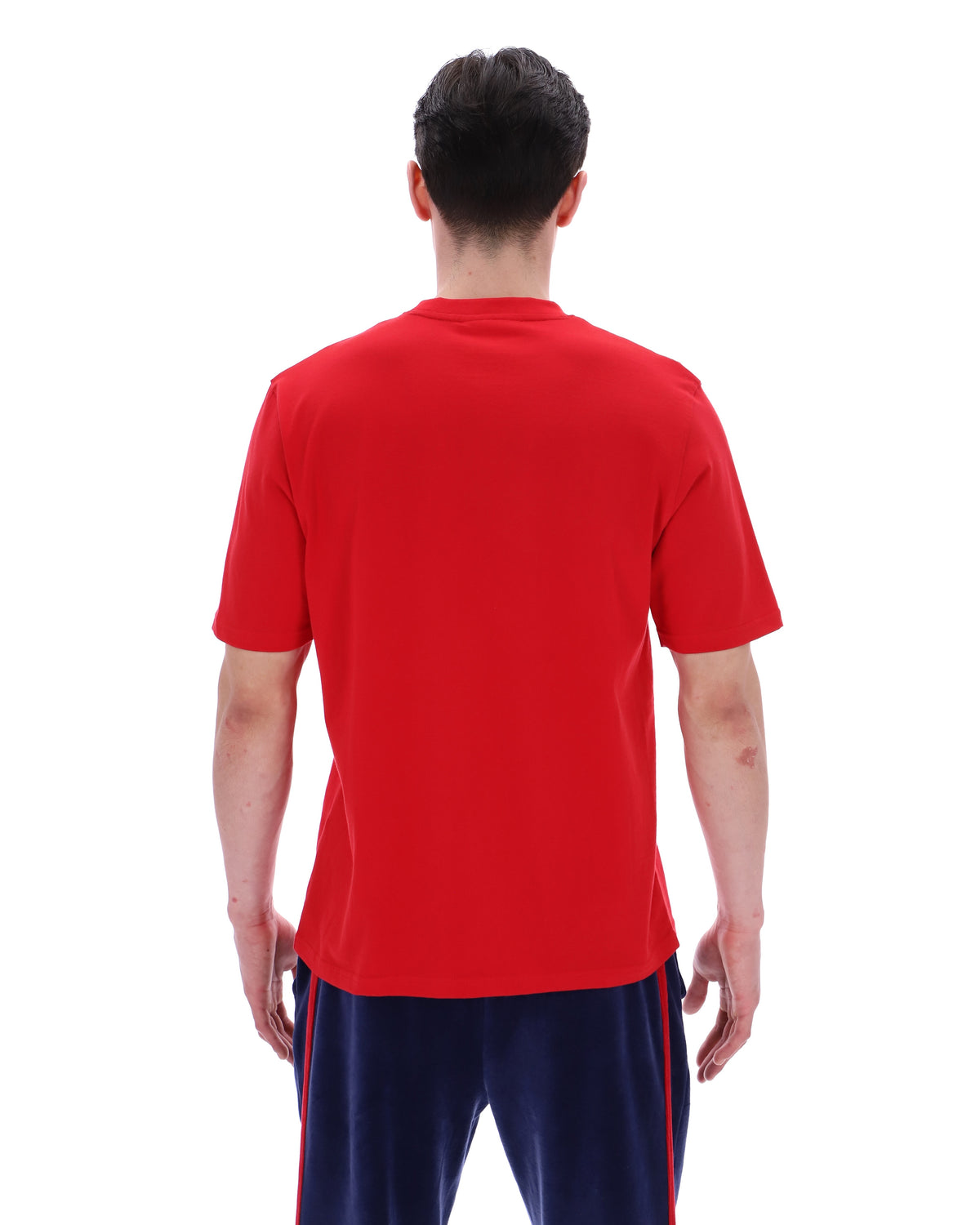 Person wearing a red shirt and navy shorts with red stripes on a white background