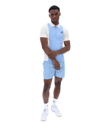 Displays a model wearing the Frozen 'Fila' branded Fjord Pierro Zip Up Polo