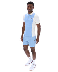Displays a model wearing the Frozen 'Fila' branded Fjord Pierro Zip Up Polo
