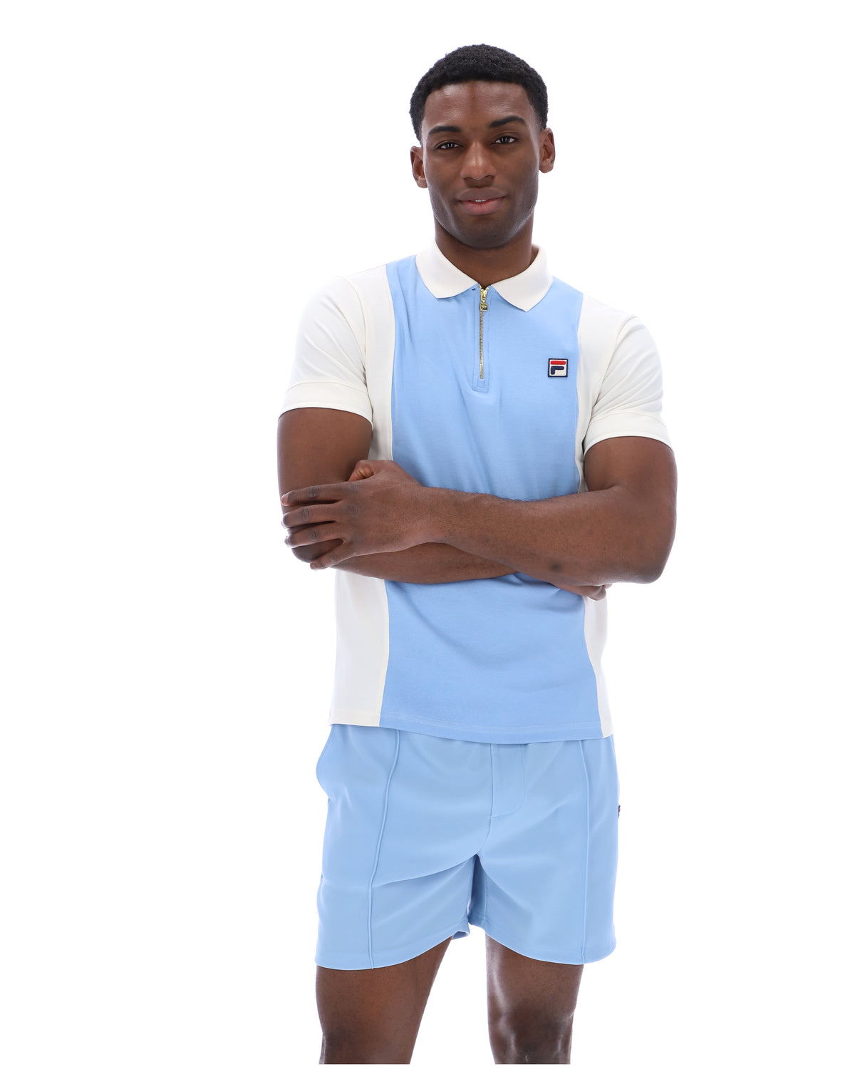 Displays a model wearing the Frozen 'Fila' branded Fjord Pierro Zip Up Polo