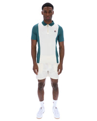 Displays a model wearing the Mediterranea 'FILA' branded Pierro Zip Up Polo