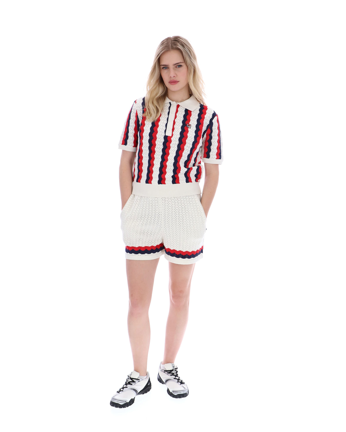 Displays a model wearing the Porto 'Fila' branded Knitted Crochet Stripe Polo