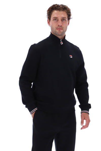Displays a model wearing the Black 'FILA' branded Ramy F-Box 1/4 Zip