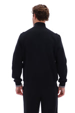 Displays a model wearing the Black 'FILA' branded Ramy F-Box 1/4 Zip