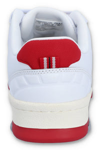A white Rissmo Low Basketball Trainer with red accents and a grey sole.
